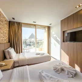 Double Or Twin Room With Balcony- Pyramids View at GreatPyramidInn overlooking the Giza Pyramids