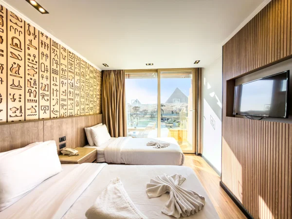 Deluxe Quadruple Room - Balcony Pyramids View5 at GreatPyramidInn overlooking the Giza Pyramids